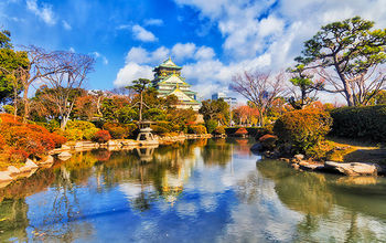 JP Osaka Castle pond during the day.