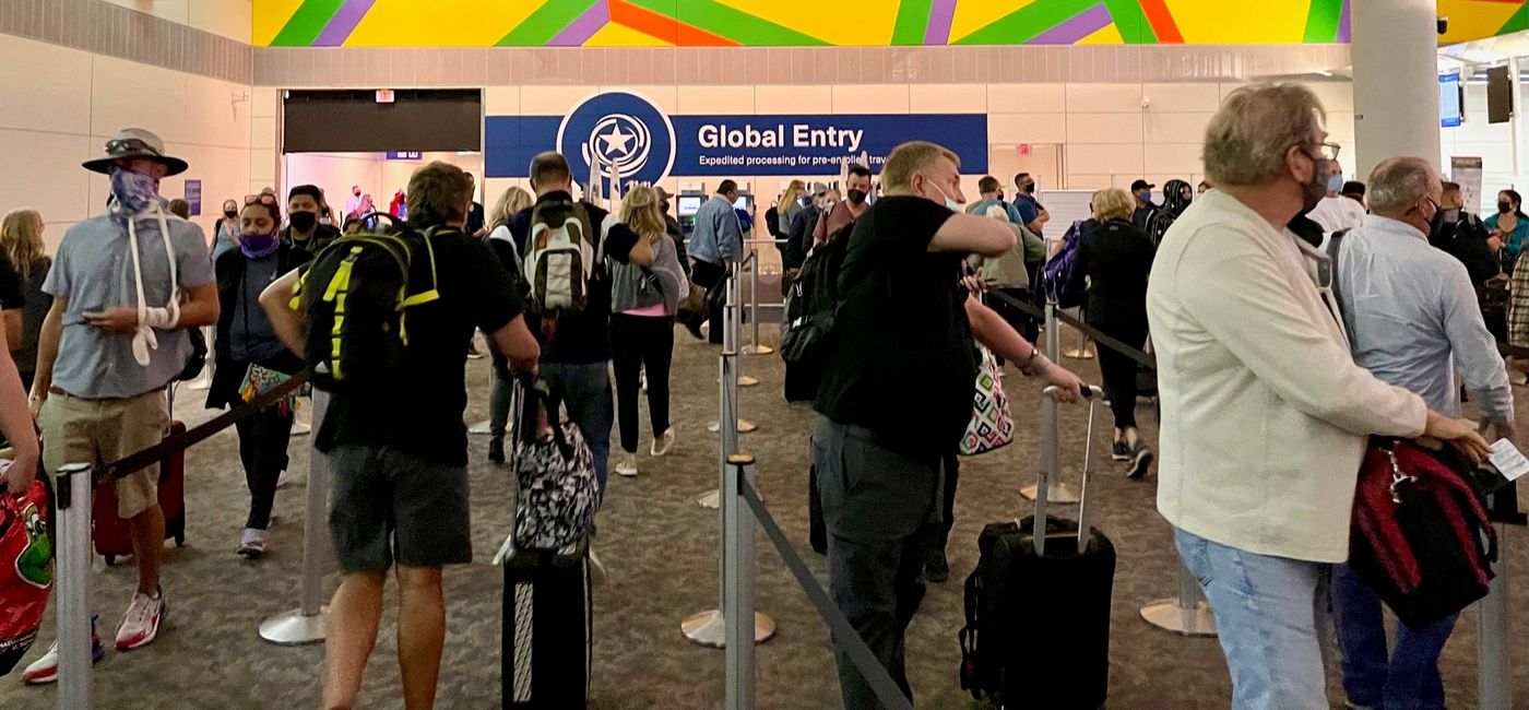 Image: A view of Global Entry kiosks through a long line at Dallas Fort Worth airport. (photo by Codie Liermann)