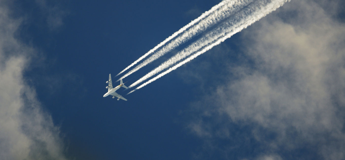 Image: Airplane emissions. (photo via Jordanlye / iStock / Getty Images Plus)