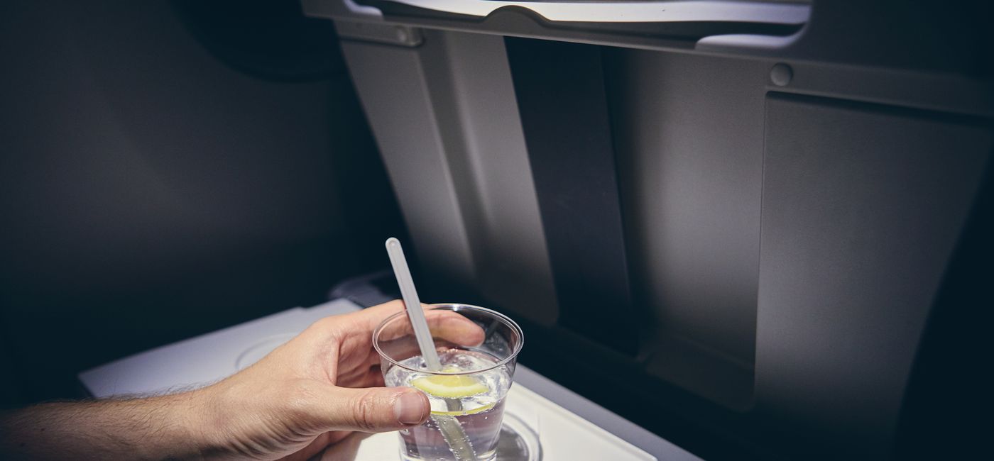 Image: Alcohol drink on board airplane  (photo via Chalabala / iStock / Getty Images Plus)