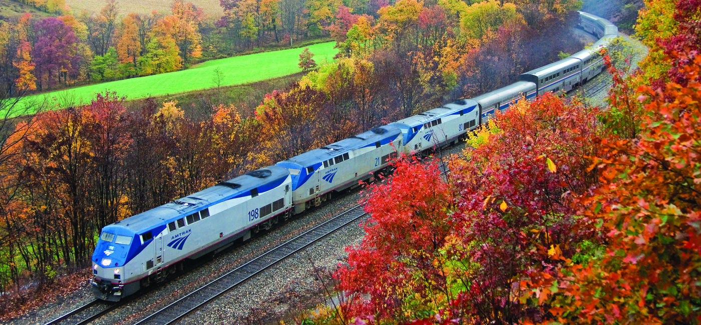 Image: Amtrak's Capitol Limited travels through the Allegheny Mountains between Pittsburgh and Cumberland during peak fall foliage season. (Photo courtesy of Amtrak) (Source: (photo via Amtrak))