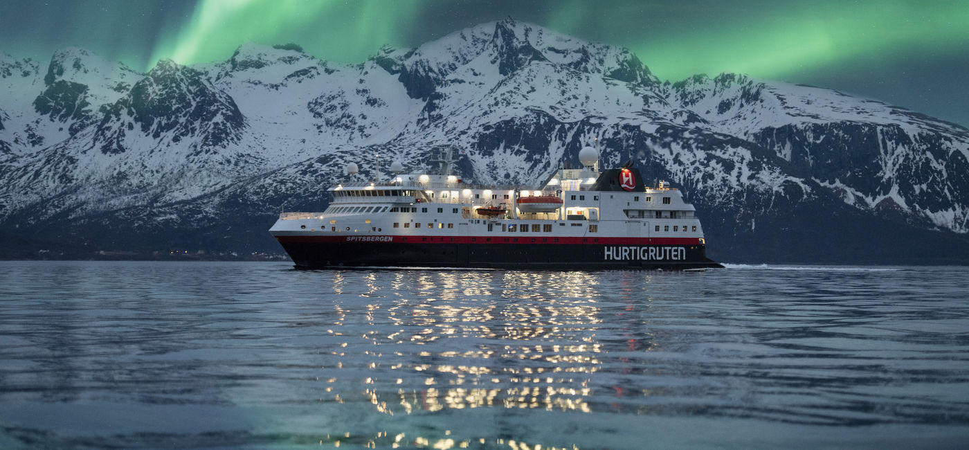 Image: Hurtigruten ship sails under the Northern Lights in Norway. (photo via Hurtigruten/Hege Abrahamsen)