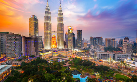 Petronas Towers, also known as Menara Petronas is the tallest buildings in the world from 1998 to 2004. (photo via Rat0007 / iStock / Getty Images Plus)
