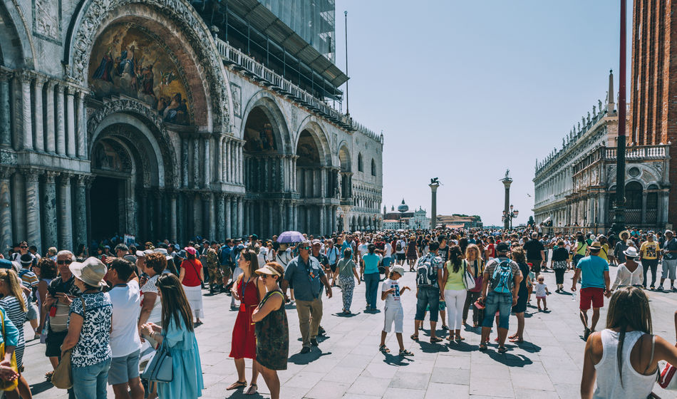 Crowds of travelers in St. Mark's Square, Venice, Italy