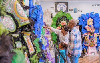 Family Visiting Backstreet Cultural Museum by Justen Williams