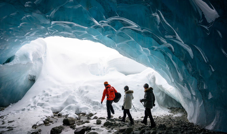 Guided tour in a glacial ice cave